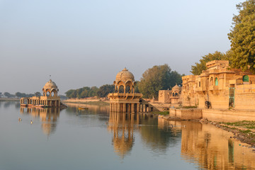 Gadisar lake in the morning. Man-made water reservoir with temples in Jaisalmer. India