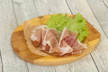 Italian prosciutto pork meat over board