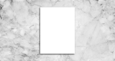 White poster on marble wall. or blank paper labels on the tile wall.Information promoting ideas for marketing announcements and details.