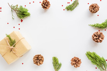 Christmas composition. fir branches and cones, gift box on white background. new year concept. Greeting card, winter holidays, xmas celebration 2020. Flat lay, top view, copy space, mockup, template