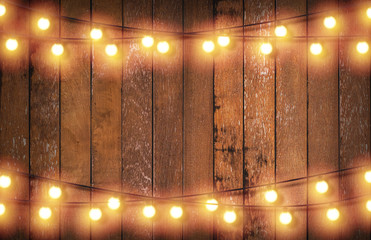 Light bulb on wooden background ,Space for your task or message.
