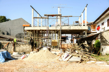 Wood, stone, sand with construction equipment at home construction site.