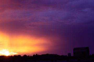 Fototapeta premium Beautiful pink and orange sunset over the city; nature background