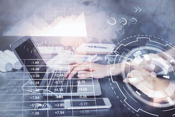 Double exposure of forex chart with man working on computer on background. Concept of market analysis.