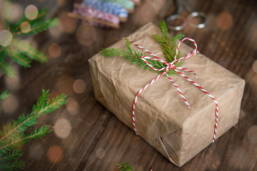 Christmas gifts box presents on brown wooden background. wrapping christmas present in craft paper