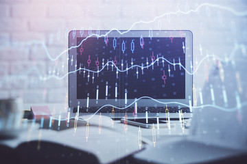 Stock market graph on background with desk and personal computer. Double exposure. Concept of financial analysis.