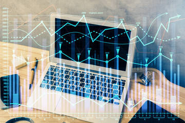 Fototapeta premium Double exposure of forex graph and work space with computer. Concept of international online trading.