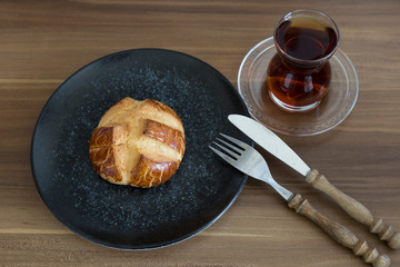 Turkish pastry products are Pogaca, Simit at patisserie on the wooden background.