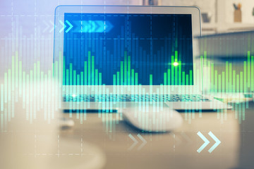Forex Chart hologram on table with computer background. Double exposure. Concept of financial markets.
