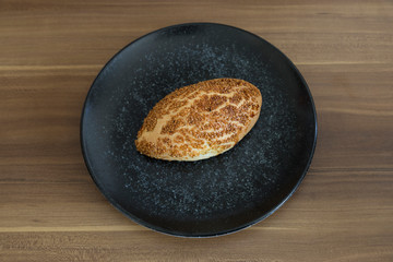 Turkish pastry products are Pogaca, Simit at patisserie on the wooden background.