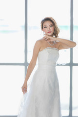 Asian bride standing and poses.. © Bangkok Click Studio