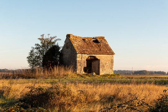 old ruin house abandonned sunset view field