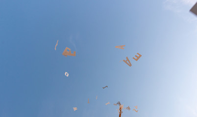 Flyting letters drop sky blue white books litterature