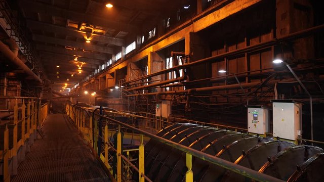 Workshop for the production of iron ore concentrate. Enrichment of iron ore. The camera moves with faith to the bottom.
