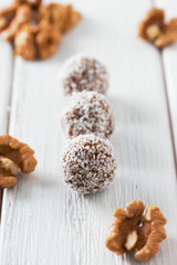 Homemade natural candy made from nuts, fruit dates and coconut. Healthy vegan food.