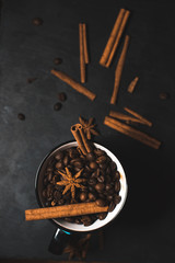 cup of coffee beans on dark background