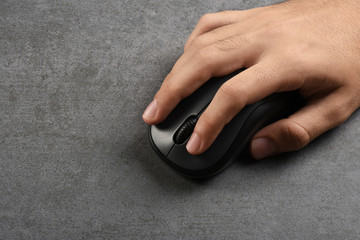 A male finger pushing computer mouse push button with copy space