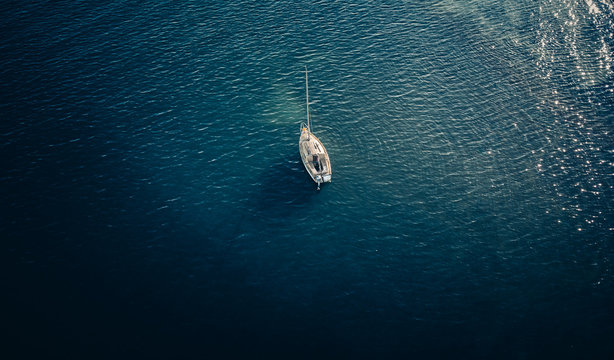 Overhead views ofa small yacht on the water
