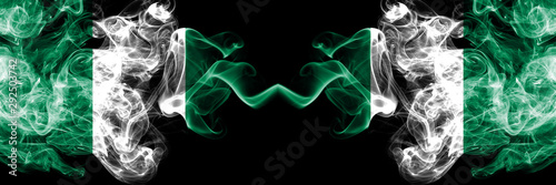 Nigeria vs Nigeria, Nigerian abstract smoky mystic flags placed side by side. Thick colored silky smoke flags of Nigerian and Nigeria, Nigerian