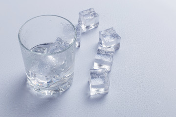 Glass of water with ice isolated on white background.