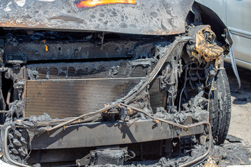 burnt in front of a passenger car close-up