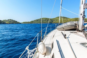 Sailing boat near Croatian island Lastovo. View from the deck of the yacht. Vacation on a boat....
