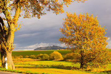 A bright autumn day in October with a view of the old Amöneburg near Marburg built on a volcanic...