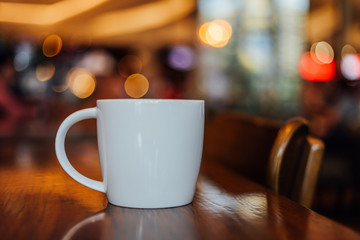 cup of coffee espresso on the wood desk in coffee shop cafe