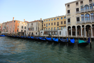 Gondolas on a pier at Grand Canal, Venice, Italy.