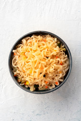 Instant soba noodles with carrot, shot from the top with copy space