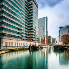 Canary Wharf with new skyscraper and old boats, London, United Kingdom
