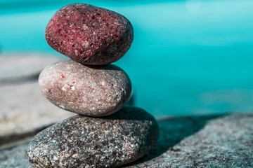 Fototapeta na wymiar zen stones on the beach with sea view