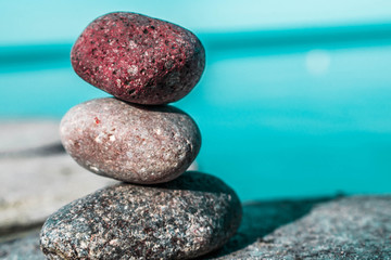 Fototapeta na wymiar zen stones on the beach with sea view