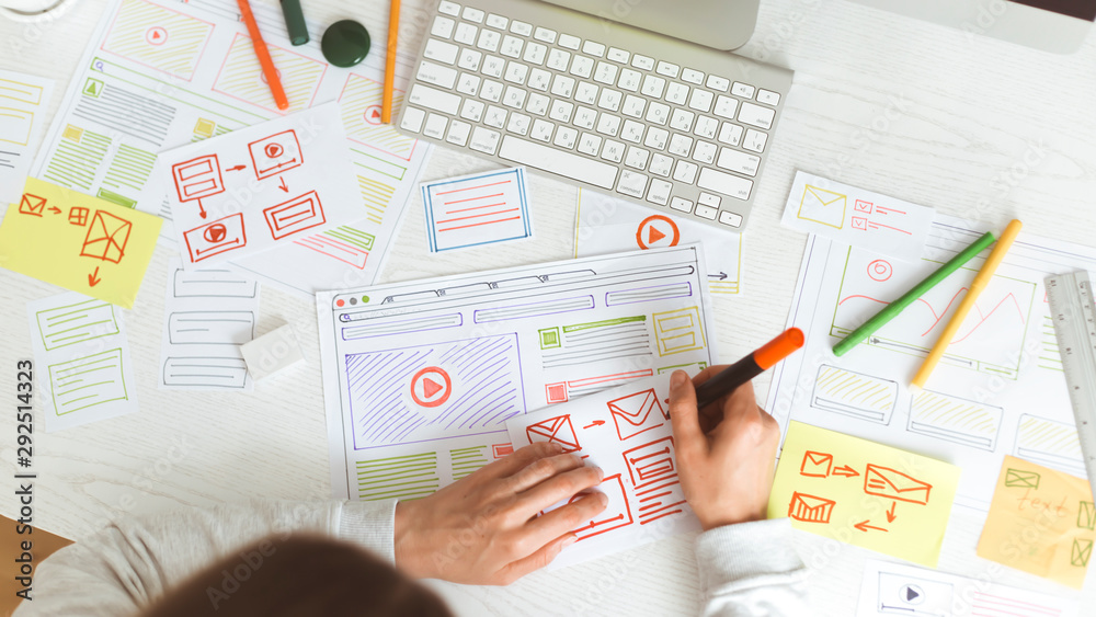 Poster website designer creates a sketch application. developing a project drawing an interface mockup.
