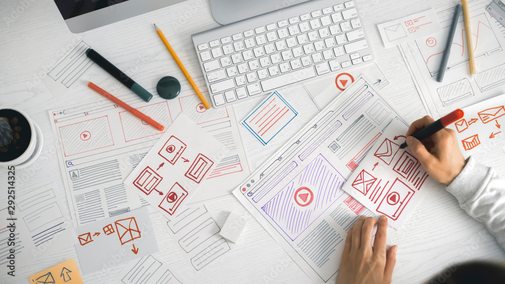 Poster website designer creates a sketch application. developing a project drawing an interface mockup.