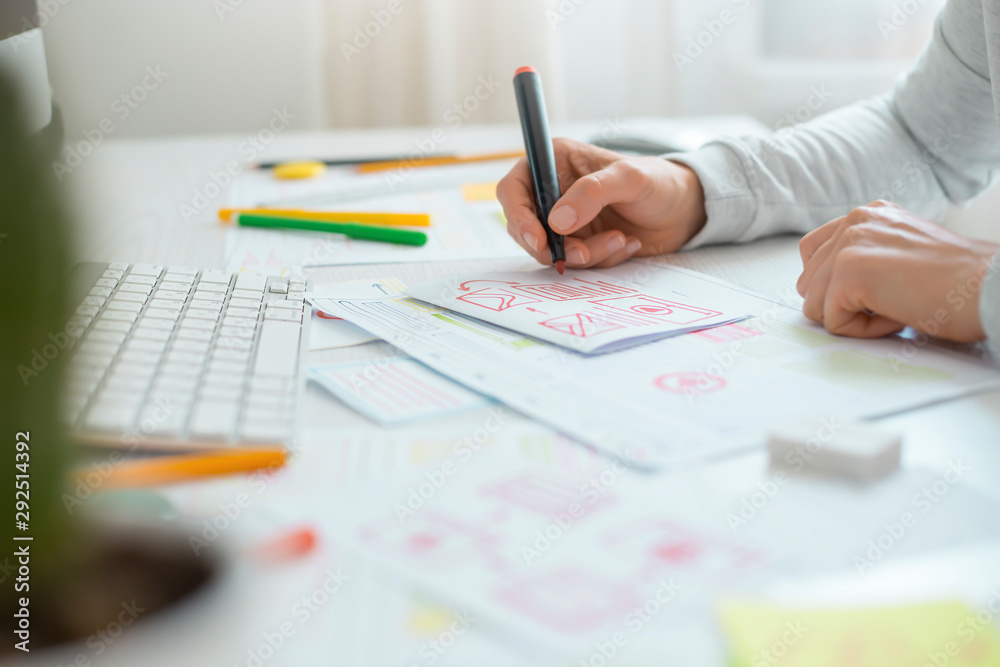 Poster website designer creates a sketch application. developing a project drawing an interface mockup.