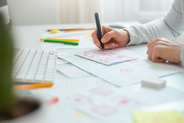 Website designer creates a sketch application. Developing a project drawing an interface mockup. 