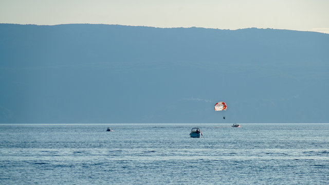 Evening parachute flights over the Adriatic Sea