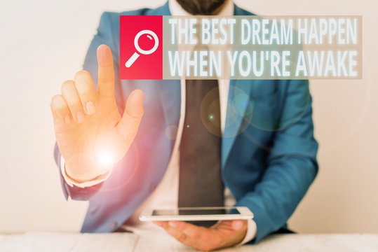 Writing note showing The Best Dream Happen When You Re Awake. Business concept for Dreams come true Have to believe Businessman with pointing finger in front of him