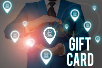 Word writing text Gift Card. Business photo showcasing A present usually made of paper that contains your message Male human wear formal work suit presenting presentation using smart device