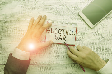 Handwriting text writing Electric Car. Conceptual photo an automobile that is propelled by one or...