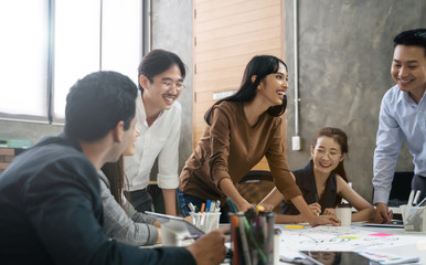 Group of Asian business people team meeting in modern office working design planning and ideas concept