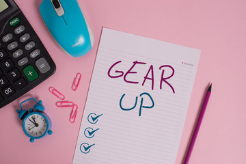 Writing note showing Gear Up. Business concept for Asking someone to put his clothes or suit on Getting ready fast Calculator clips alarm clock mouse sheet pencil colored background