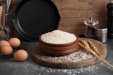 thai white jasmine rice in wooden bowl in kitchen with a blank space for a text, thai agriculture concept