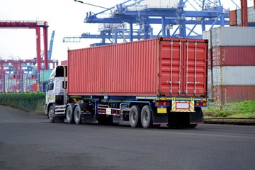 Truck on road with red container, transportation concept.,import,export logistic industrial Transporting Land transport on Port transportation storge