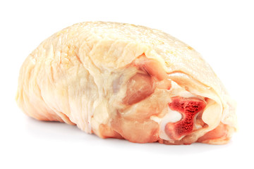 Raw chicken thigh isolated on white background with shadow. Fresh raw chicken thigh for cooking. Raw chicken thigh, isolate, close-up. Front view.