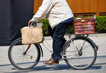 Man rides a bicycle on the city street © majorosl66