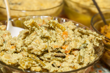 Bowl of Aviyal is a vegetable curry made with mixed vegetables, curd, coconut and seasoned with coconut oil and curry leaves served during Onam and Vishu sadya as a side in Kerala