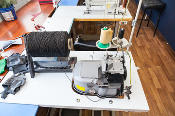 Professional sewing machine for embroidery and making clothes in the workshop.