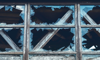 close up of a broken window of an old ruin